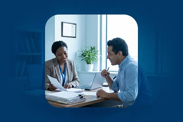 A social worker reviews ssdi documentation with a client during a disability benefits referral consultation