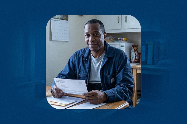 An official social security letter at his kitchen table while awaiting a disability decision