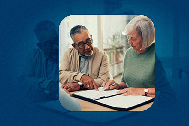 An older couple looking at documents