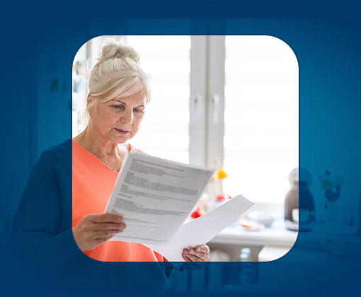 CDR 510 Woman looking at documents in her kitchen