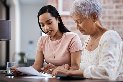Two women reviewing documents